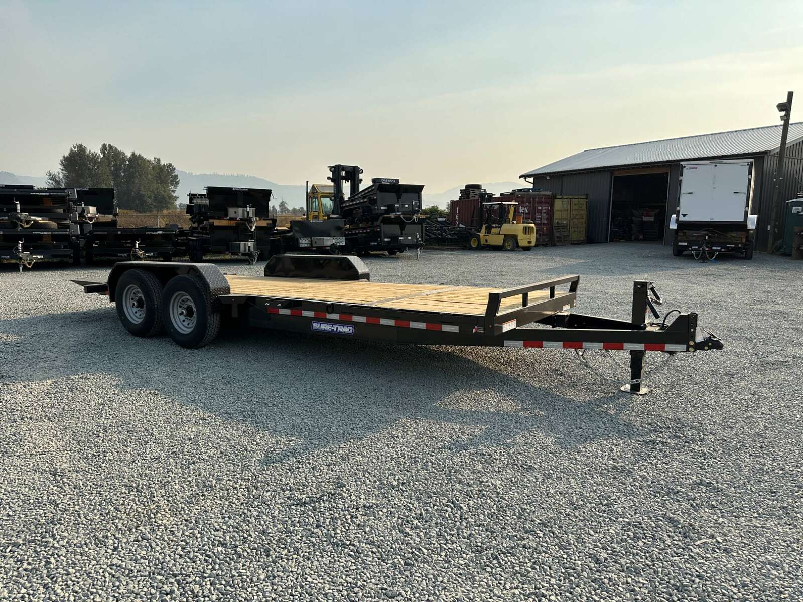 Photo of 2025 Suretrac 7x16+4 HD Tilt Deck Equipment Trailer w/ 4ft Stationary Section 14,000lb GVW