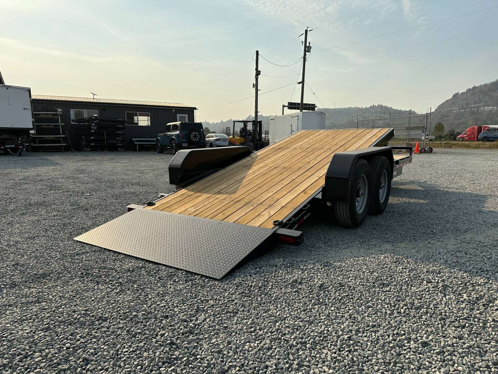 Photo of 2025 Suretrac 7x16+4 HD Tilt Deck Equipment Trailer w/ 4ft Stationary Section 14,000lb GVW