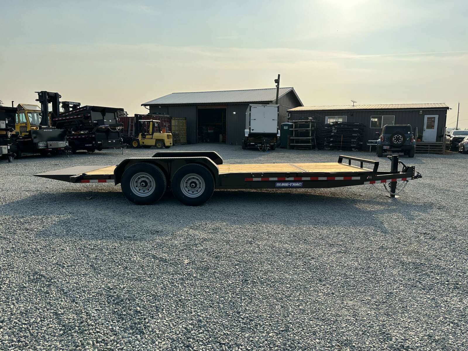 Photo of 2025 Suretrac 7x16+4 HD Tilt Deck Equipment Trailer w/ 4ft Stationary Section 14,000lb GVW
