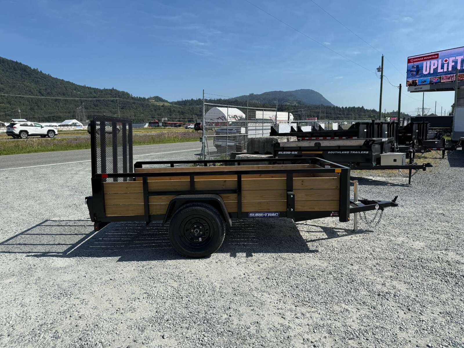 Photo of 2025 Suretrac 5x10 Landscape Utility Trailer 3 Board High Side w/ Ramp Gate 2990lb GVW