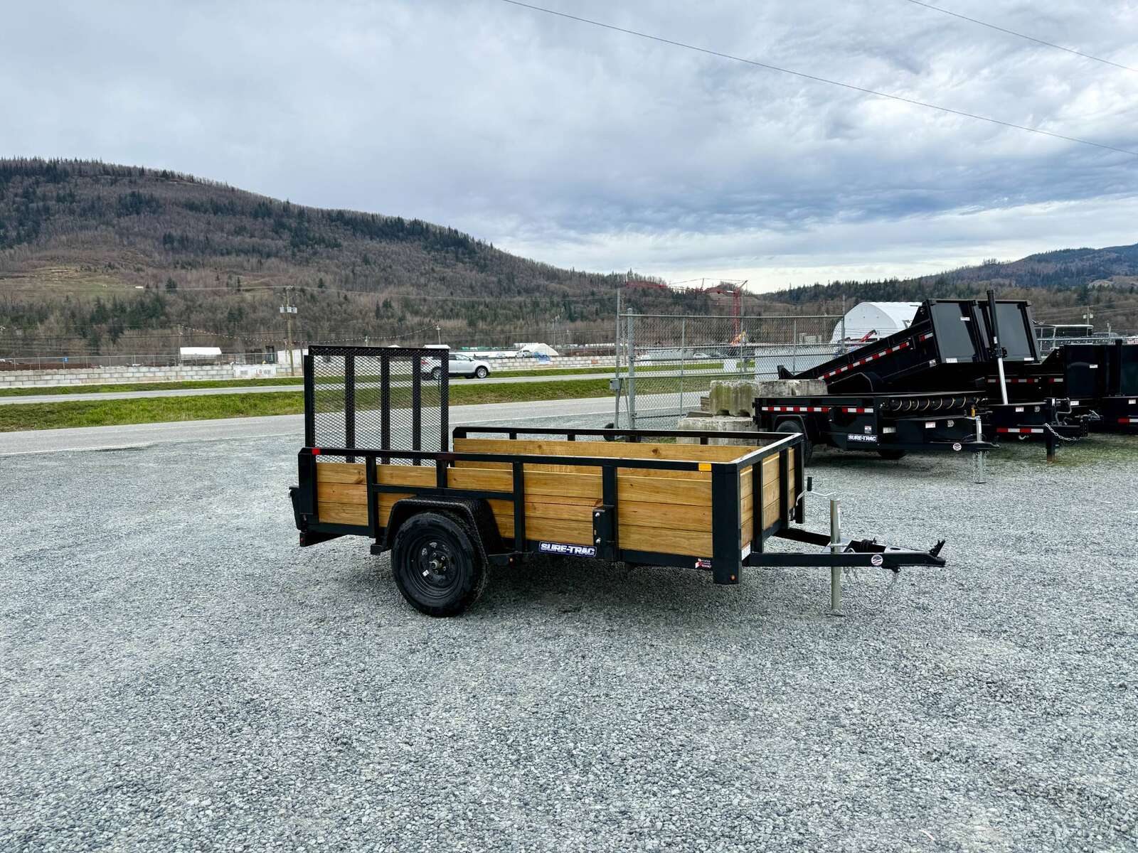 Photo of 2025 Suretrac 6x10 Landscape Utility Trailer 3 Board High Side w/ Ramp Gate 2990lb GVW