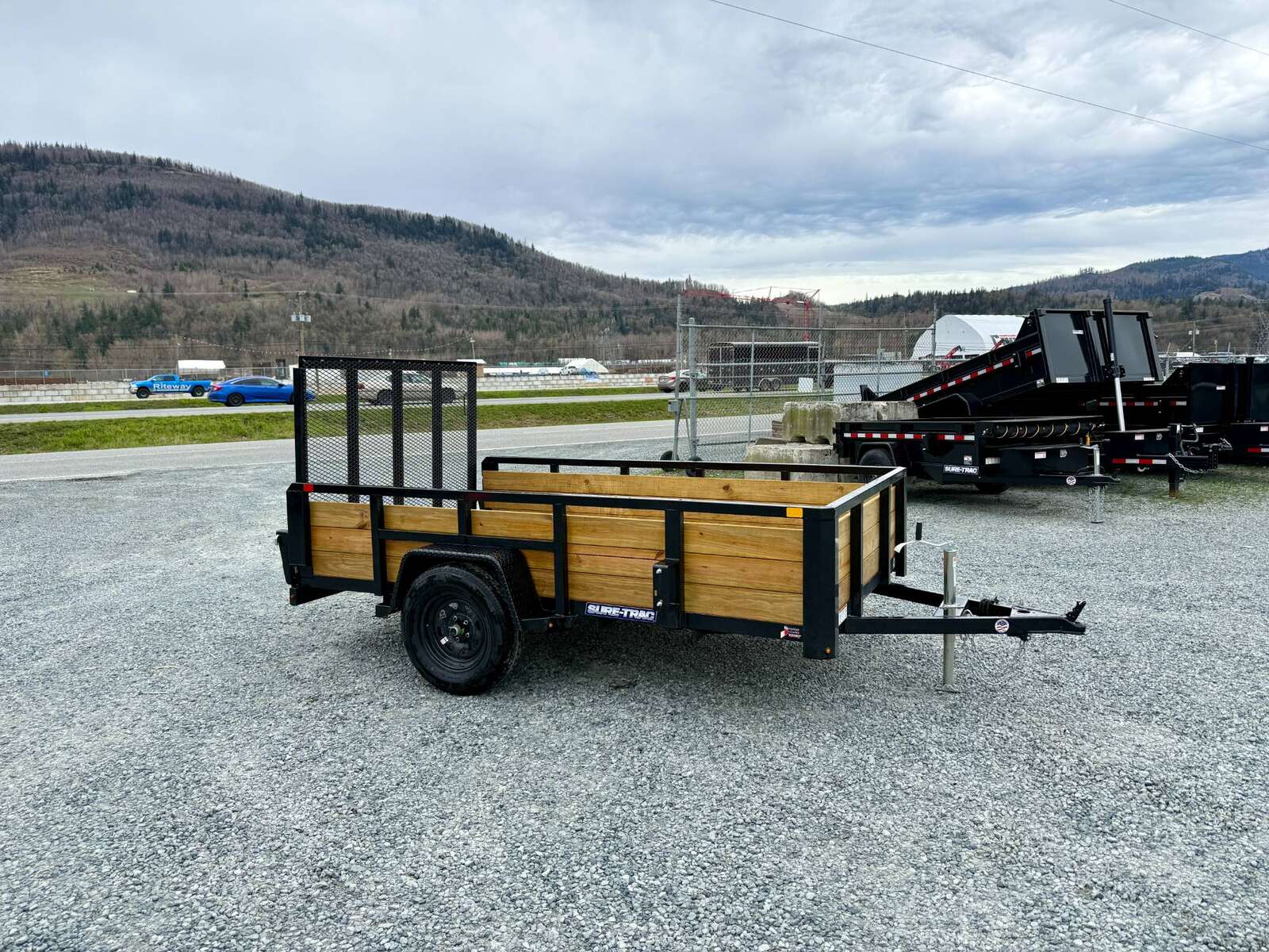 Photo of 2025 Suretrac 6x10 Landscape Utility Trailer 3 Board High Side w/ Ramp Gate 2990lb GVW