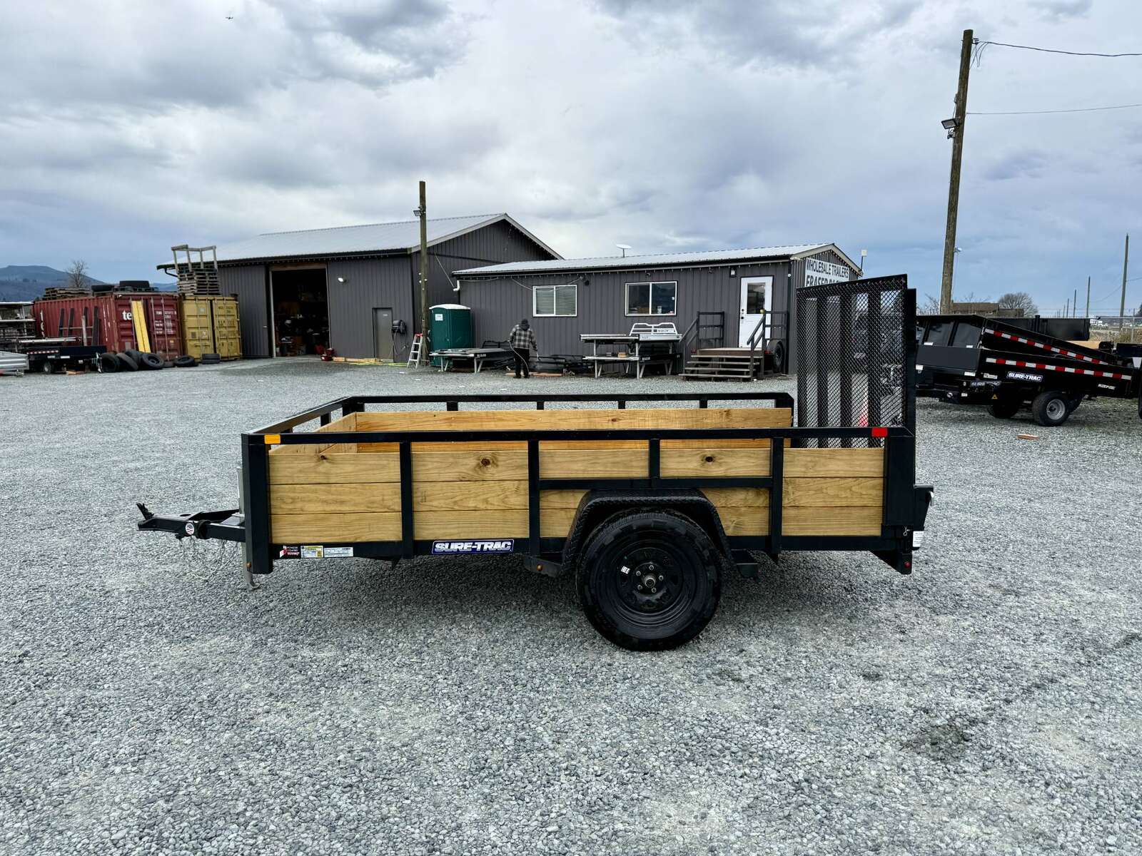 Photo of 2025 Suretrac 6x10 Landscape Utility Trailer 3 Board High Side w/ Ramp Gate 2990lb GVW