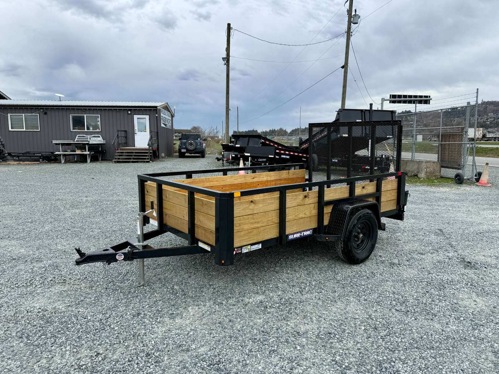 Photo of 2025 Suretrac 6x10 Landscape Utility Trailer 3 Board High Side w/ Ramp Gate 2990lb GVW