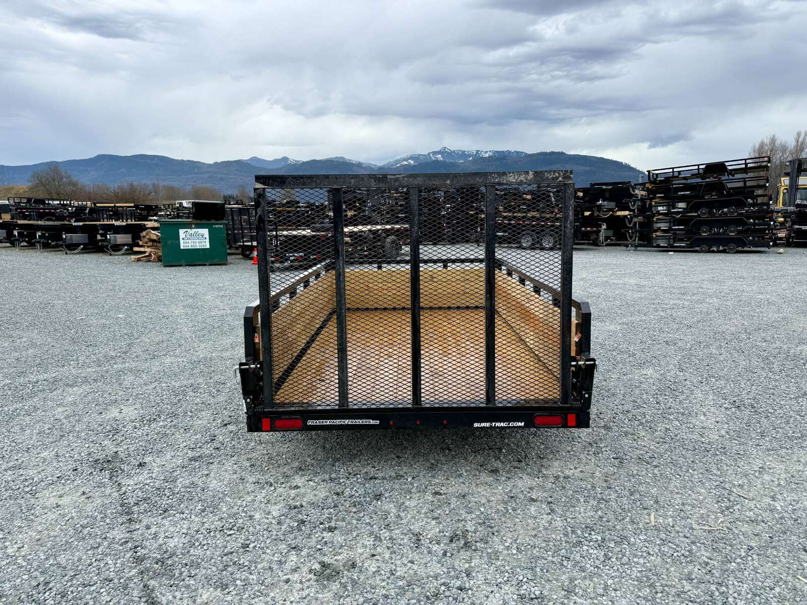 Photo of 2025 Suretrac 6x10 Landscape Utility Trailer 3 Board High Side w/ Ramp Gate 2990lb GVW